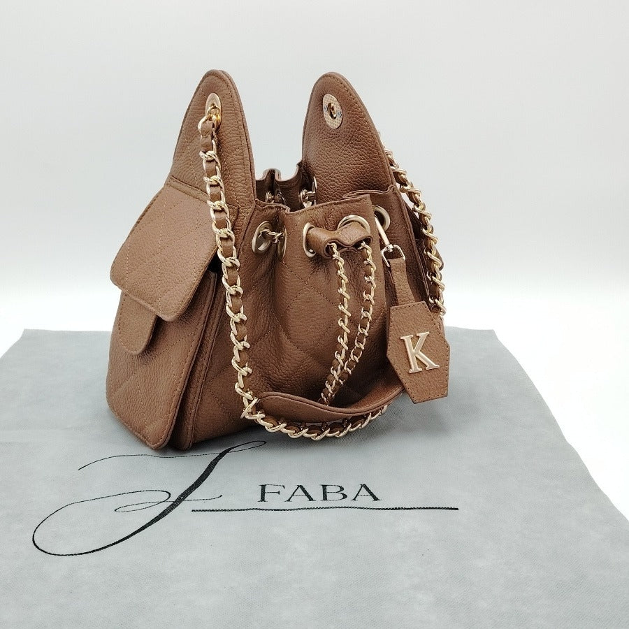 Sherlyn mini piel vacuna floter y gamuza