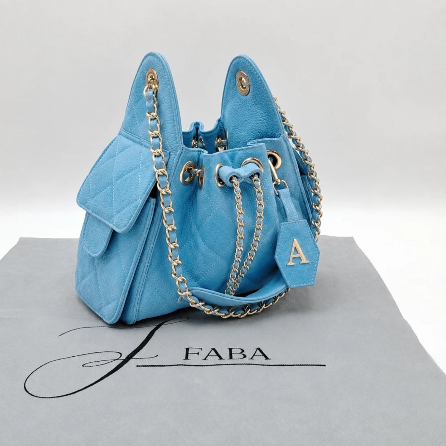 Sherlyn mini piel vacuna floter y gamuza